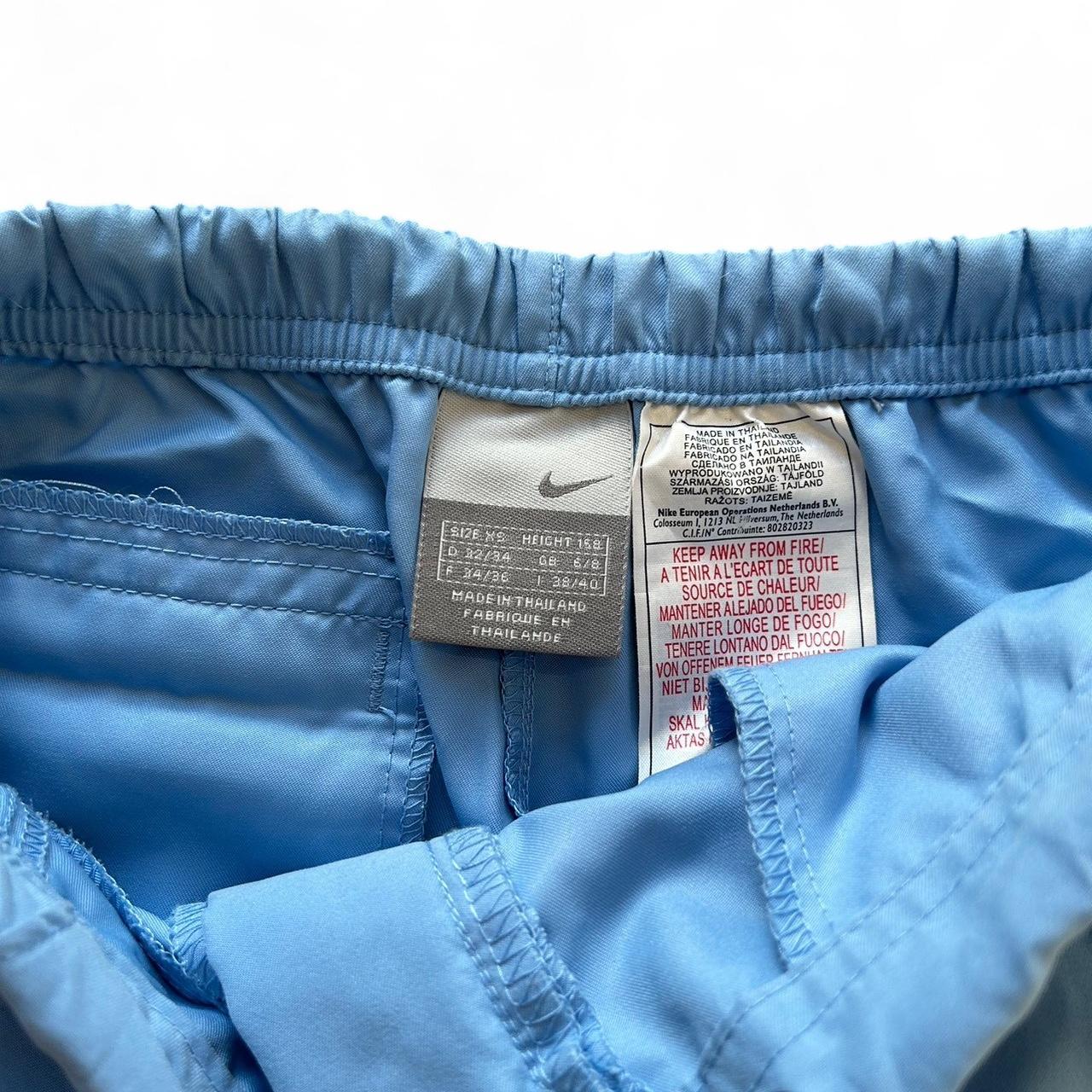 Vintage Y2K style blue Nike track pants