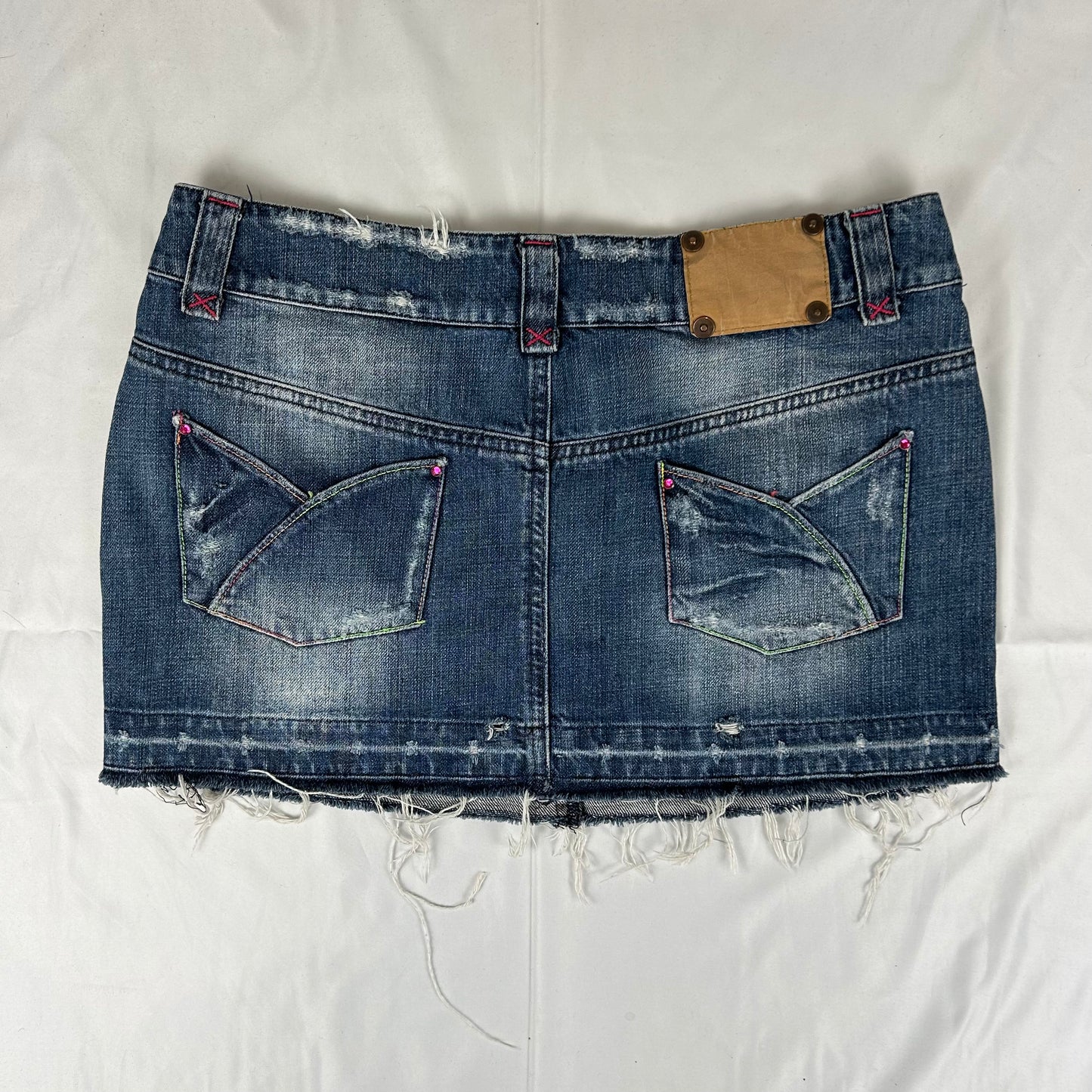 Vintage y2k style dark wash distressed denim mini skirt