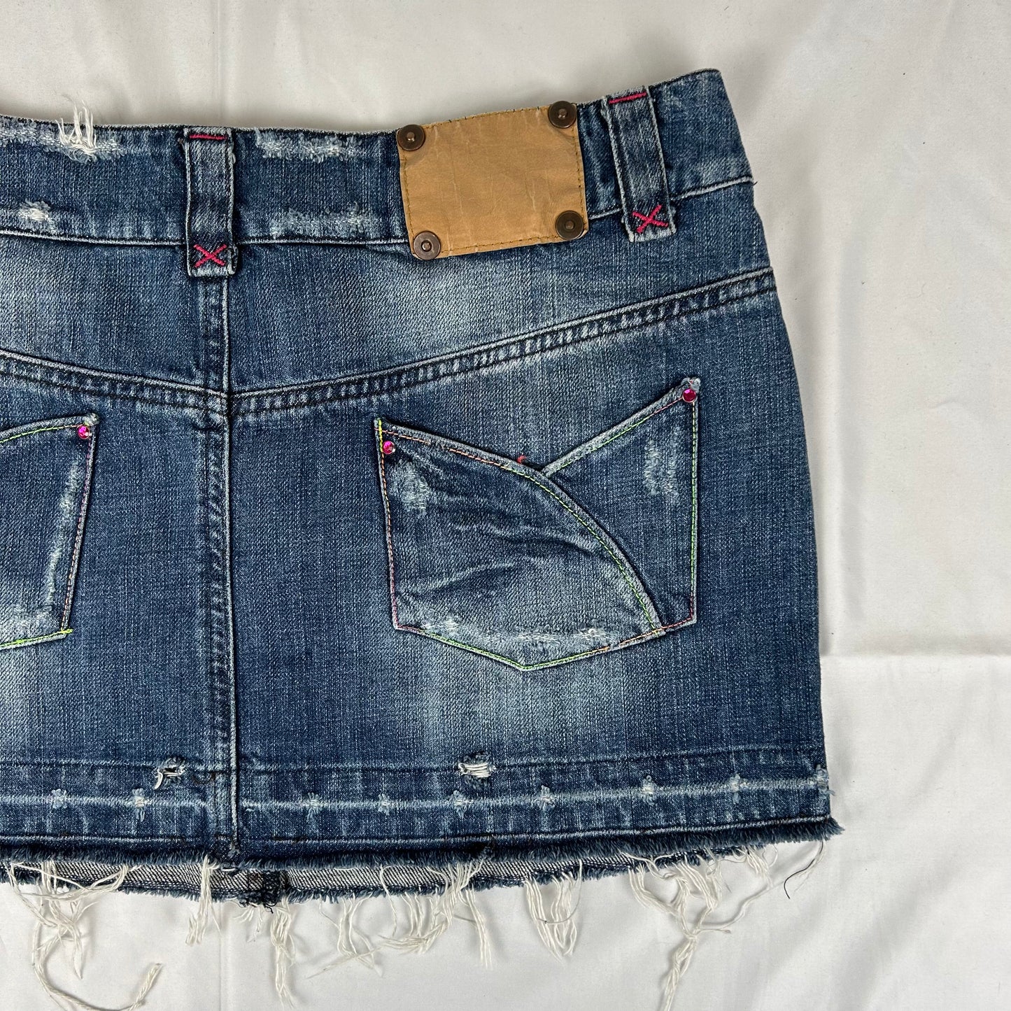 Vintage y2k style dark wash distressed denim mini skirt