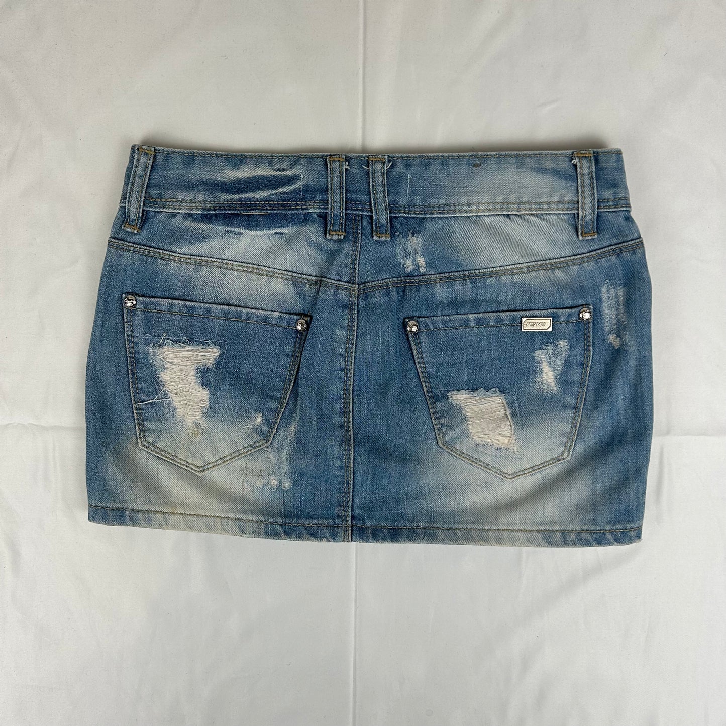 Vintage y2k style distressed denim mini skirt