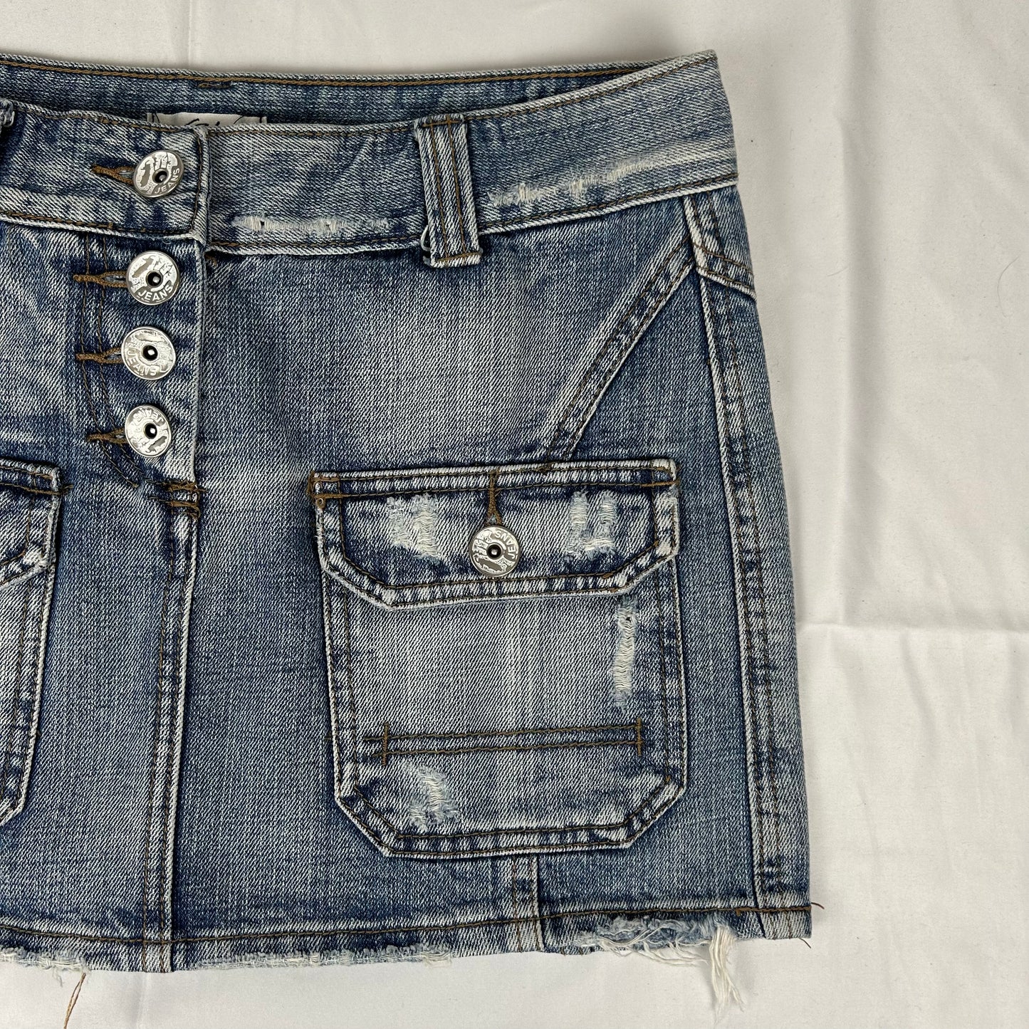 Vintage y2k style faded denim mini skirt