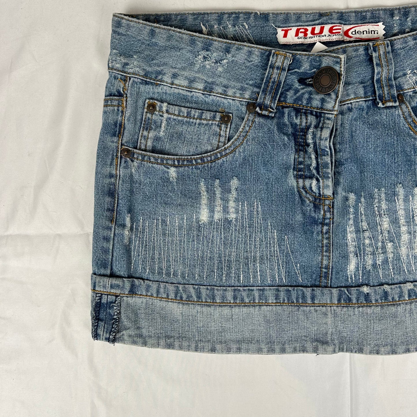 Vintage y2k style distressed denim mini skirt