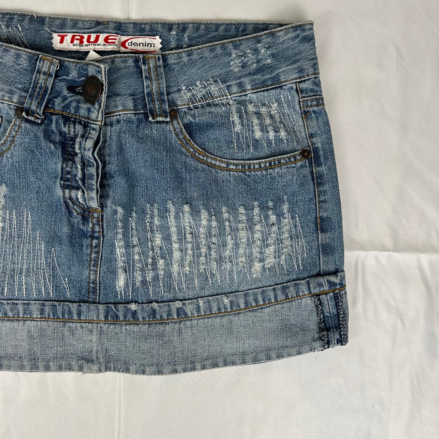 Vintage y2k style distressed denim mini skirt