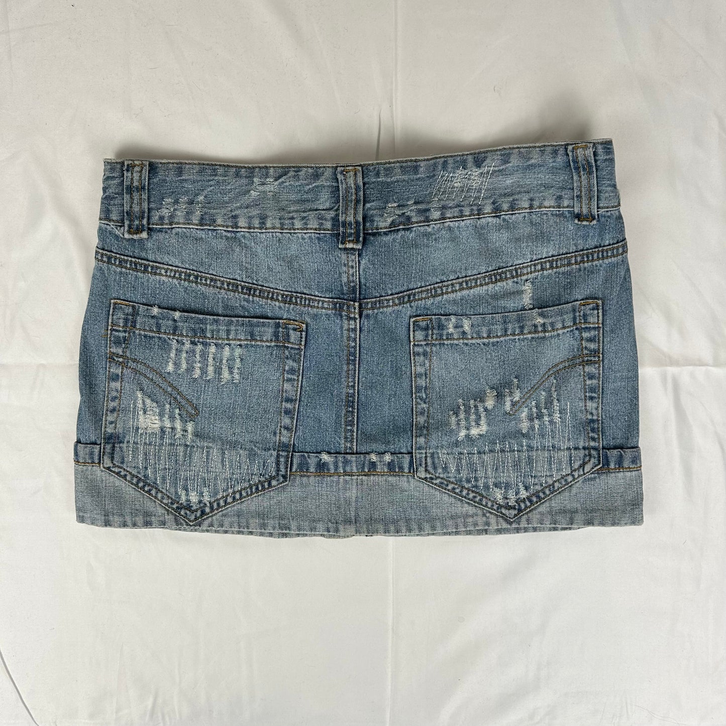 Vintage y2k style distressed denim mini skirt