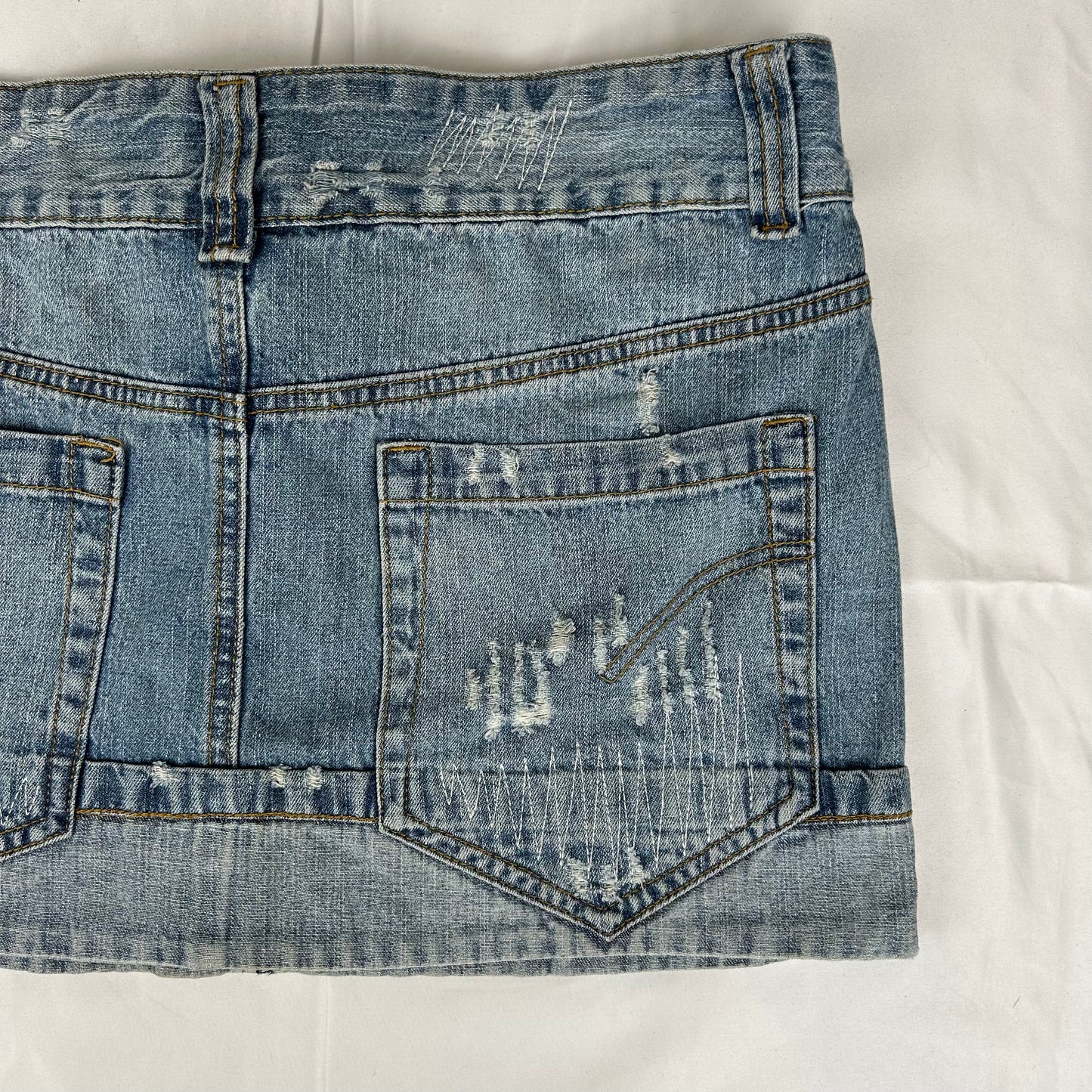 Vintage y2k style distressed denim mini skirt