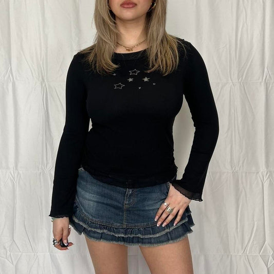 Vintage y2k style black long sleeve top with star graphics