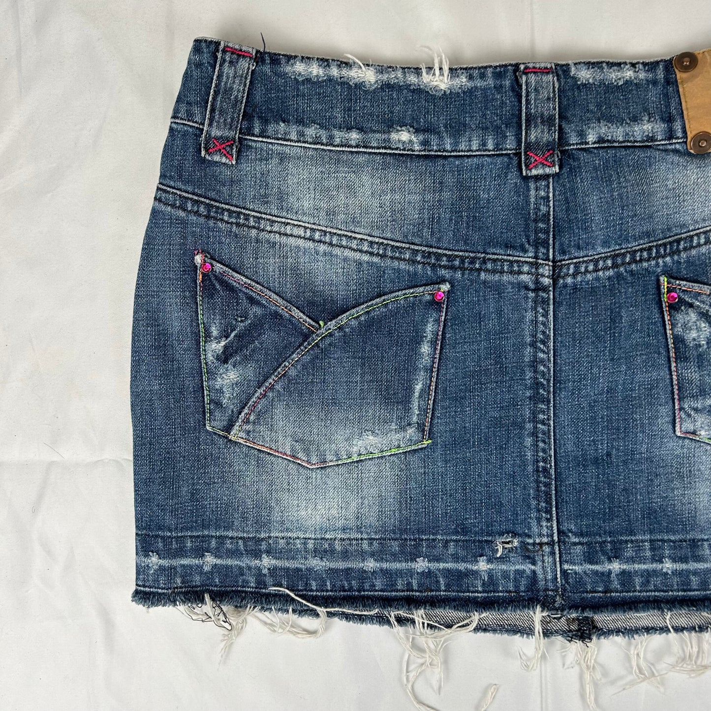 Vintage y2k style dark wash distressed denim mini skirt